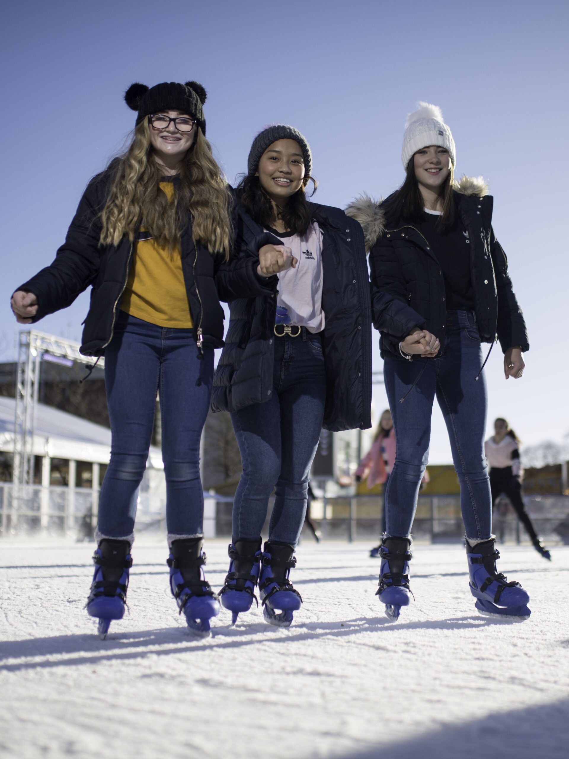 Three-girls-skating-at-Yorkshires-Winter-Wonderland-portrait.jpg